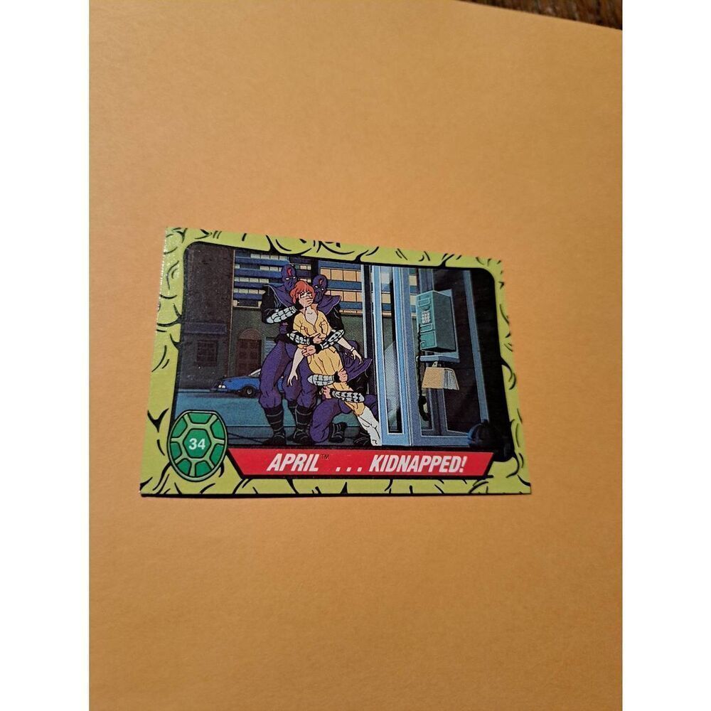 1989 Topps TMNT April Kidnapped Trading Card 34 Teenage Mutant Ninja Turtles - Picture 1 of 2